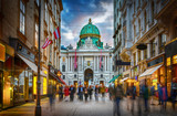 The pedestrian zone Herrengasse with a view towards imperial Hofburg palace in Vienna, Austria.