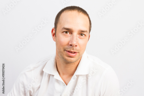handsome young man in his thirties with short hair and baldness