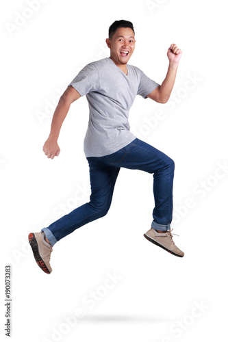 Levitation. Young Asian man jumping dancing walking
