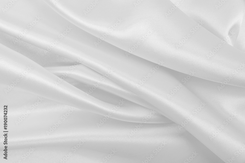 Naklejka premium Smooth elegant white silk or satin luxury cloth texture as wedding background. Luxurious Christmas background or New Year background design