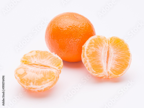 Whole and half of mandarin oranges isolated on white background