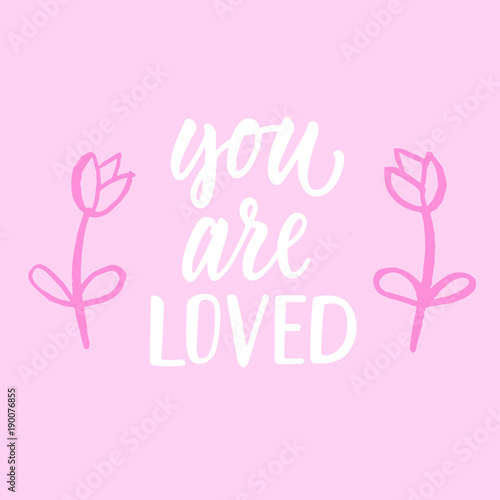 You are loved! Modern calligraphy phrase and romantic hand drawn doodle.