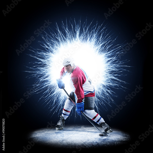 Ice Hockey player is skating on a abstract background photo