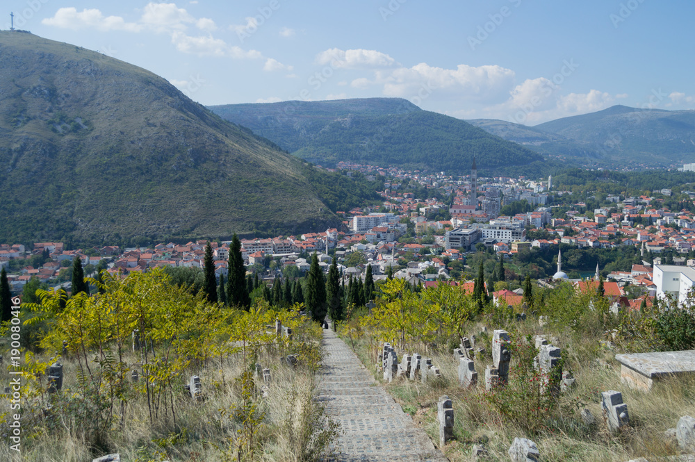 Fototapeta Mostar Old Town and New Town Panorama with Cemetery and Mountain Backdrop, Bosnia and Herzegovina
