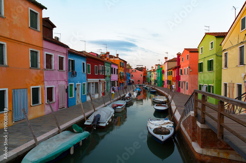 Colorful houses and boats in Burano, Venice Italy. © Shchipkova Elena