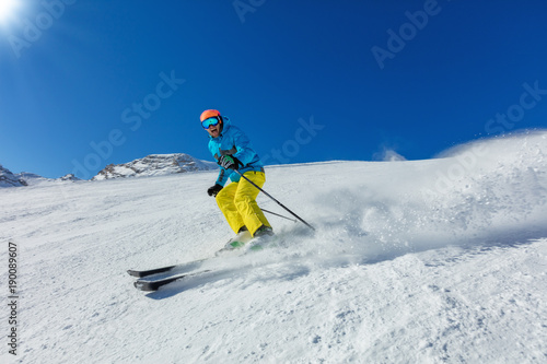 Young man skiing downhill in Alps © Jag_cz