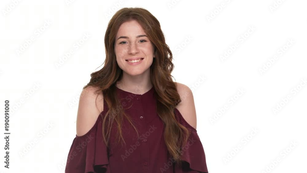 Portrait of gorgeous brown-haired woman expressing love and affection giving air kiss on camera, isolated over white background. Concept of emotions Portrait of gorgeous brown-haired woman expressing love and affection giving air kiss on camera, isolated over white background. Concept of emotions