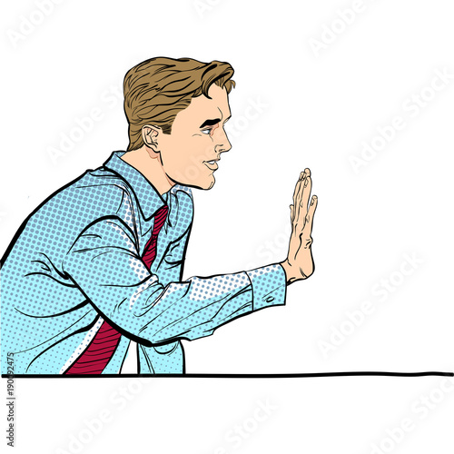 Sitting man stopping someone. Man stopping someone. Man rejecting something. Forbidding man. Handsome young businessman giving stop signal.