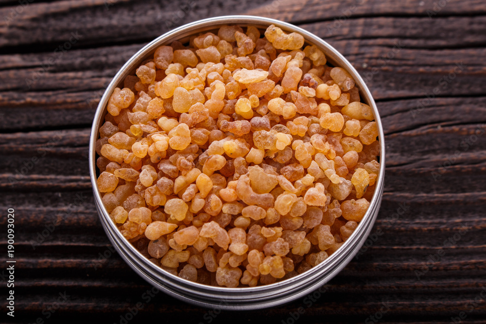 frankincense essential oil on a wooden background frankincense essential oil on a wooden background