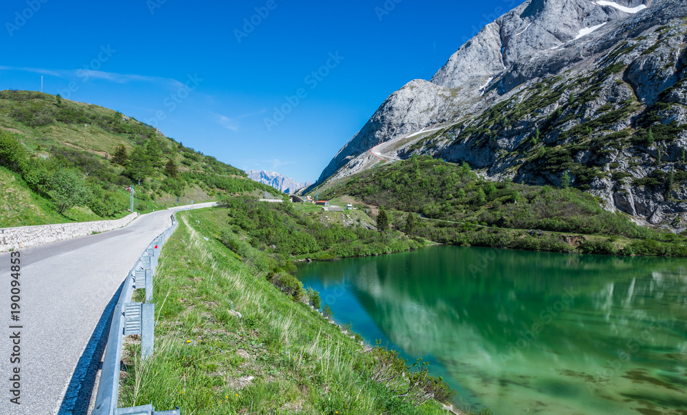 The Pass Fedaia ( 2054 m) is denominated by the Fedaia Lake, a nuge 2 Km long dike , on the foot of the Marmolada glacier, the queen of the Dolomites, Fassa Valley, Trentino Alto Adige, Italy.