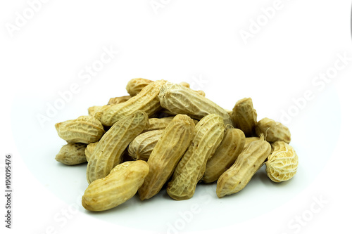 Pile of penuts on white background photo