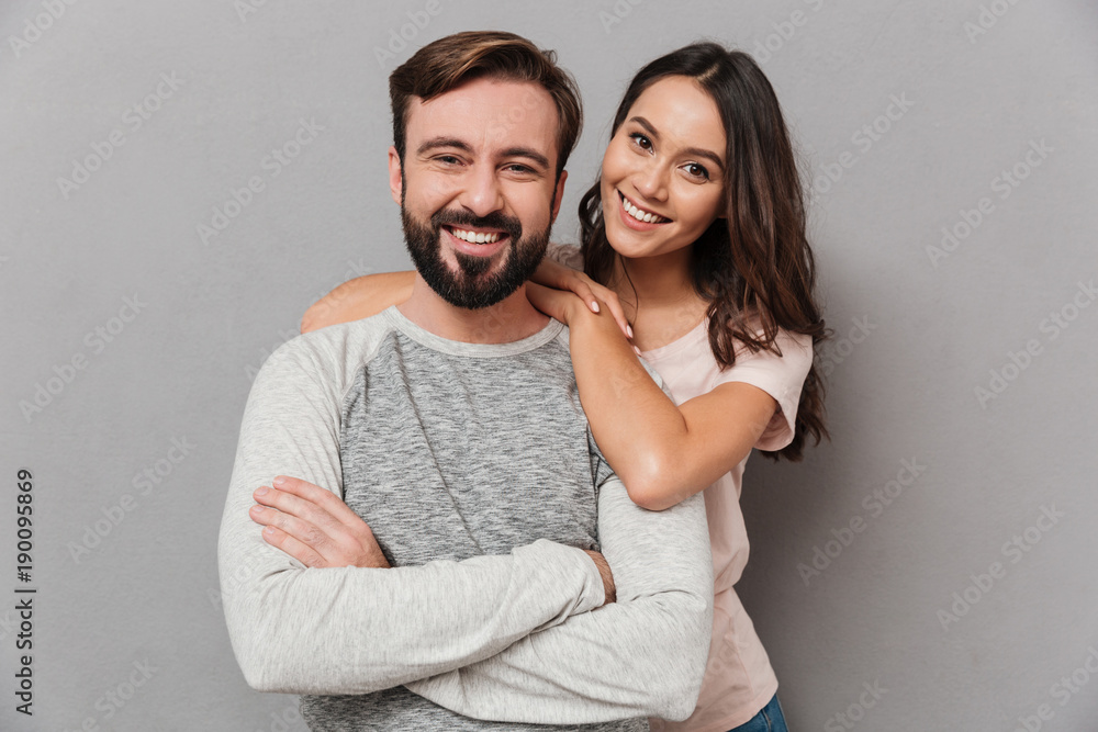 Portrait of a beautiful young couple hugging Portrait of a beautiful young couple hugging