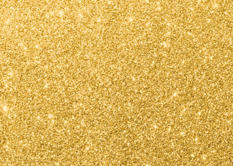 Gold glitter texture sparkling shiny wrapping paper background for Christmas holiday seasonal wallpaper  decoration, greeting and wedding invitation card design element