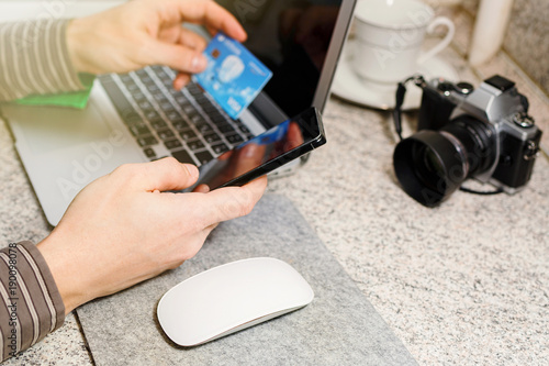 Wallpaper Mural Man makes online banking transaction via internet Torontodigital.ca