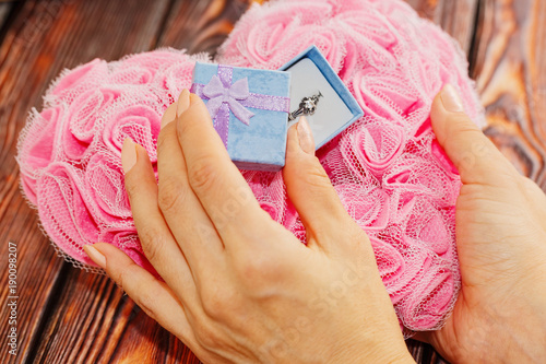 Wallpaper Mural Girl opens a box with wedding ring, gift concept Torontodigital.ca