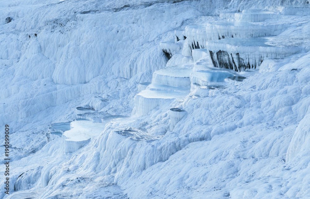 Fotografie Landscape of  Travertine pools limestone terraces on bright day in Pamukkale, De