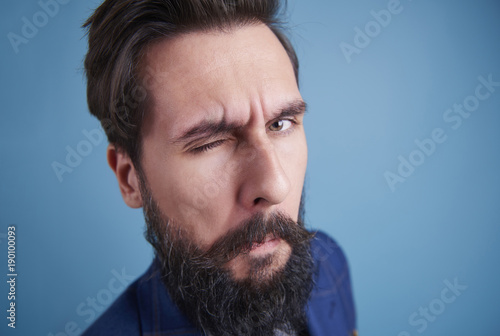 Canvas Print Handsome man with beard winking