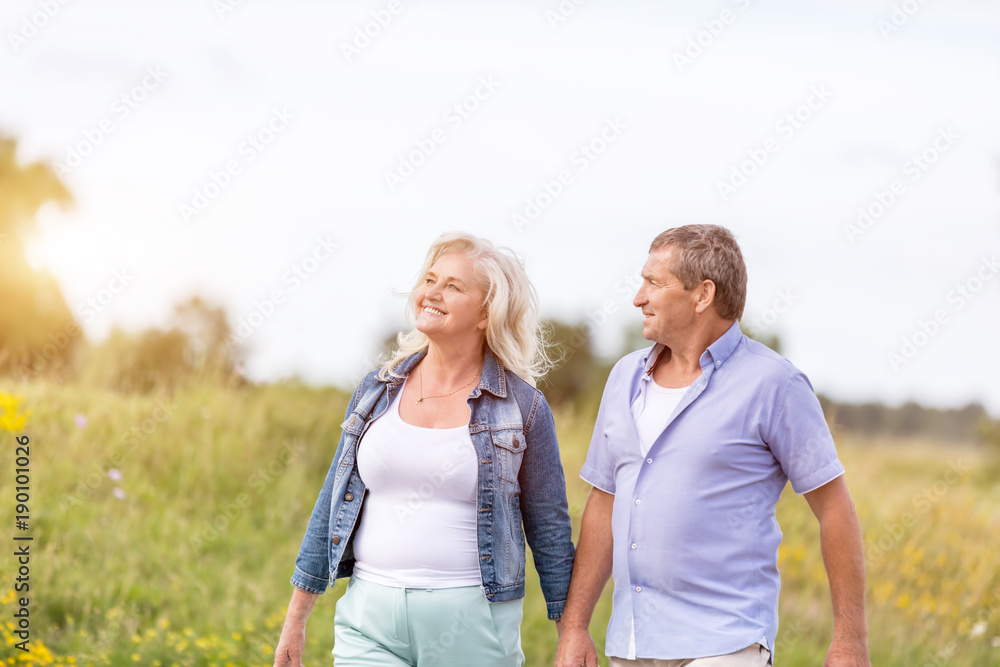 Man and woman holding hands, walking. Man and woman holding hands, walking.