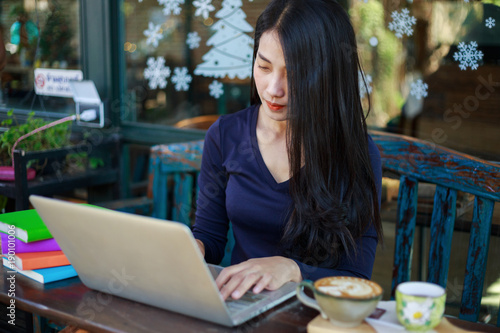 Free Download woman working with laptop in the cafe - GFXLoad