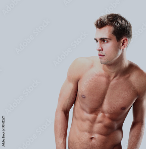 Portrait of a muscular man posing against white background.