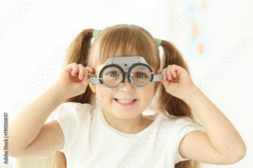 Cute little girl with trial...