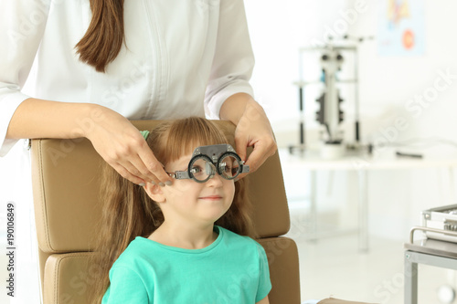 Ophthalmologist examining v...