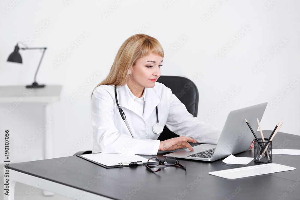 Female doctor in consultation room Female doctor in consultation room