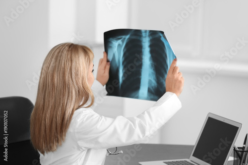 Female doctor with x-ray im...