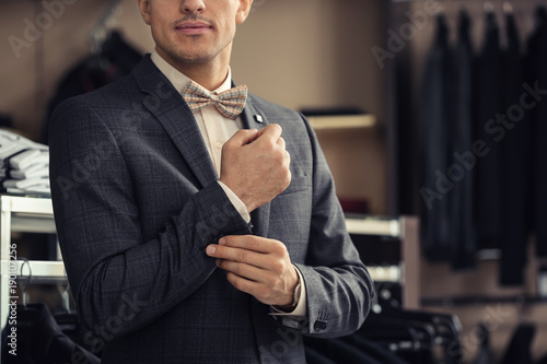 Young man in elegant suit a...