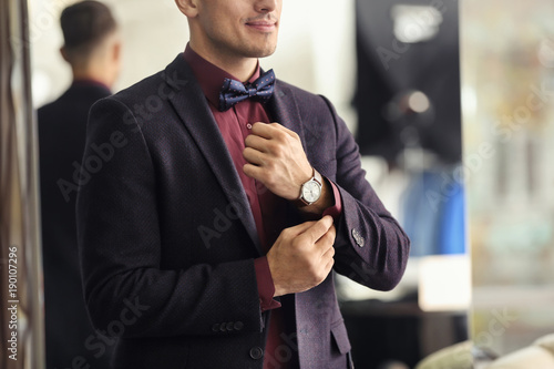 Young man in elegant suit o...