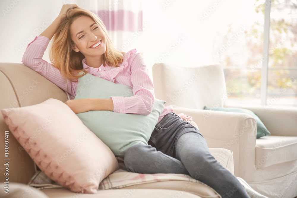 Young woman with soft pillow at home Young woman with soft pillow at home