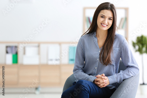 Young female psychologist at workplace photo