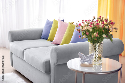 Living room interior with comfortable couch and soft pillows