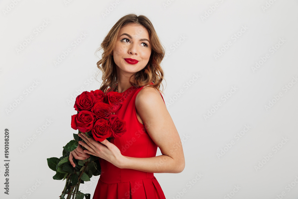 Portrait of a beautiful young woman dressed in red dress Portrait of a beautiful young woman dressed in red dress