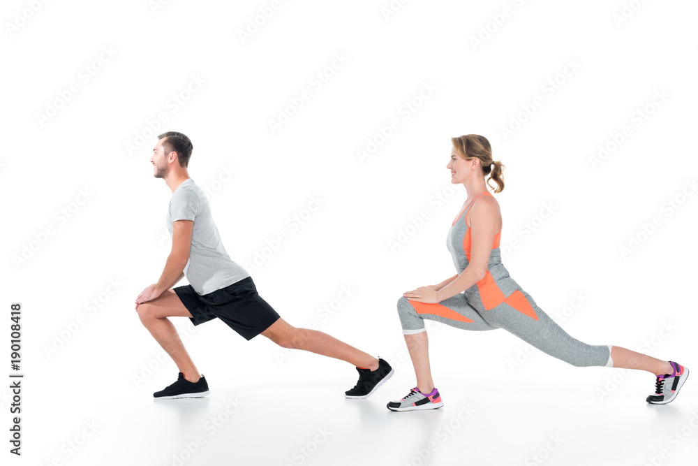 side view of sportive couple warming up before training isolated on white side view of sportive couple warming up before training isolated on white