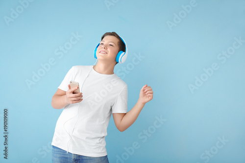 Teenage boy with headphones...