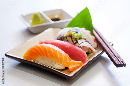 Sushi salmon & tuna sushi shrimp and wasabi on the white plate.selective focus 