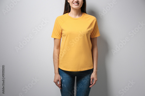 Woman in yellow t-shirt on ...