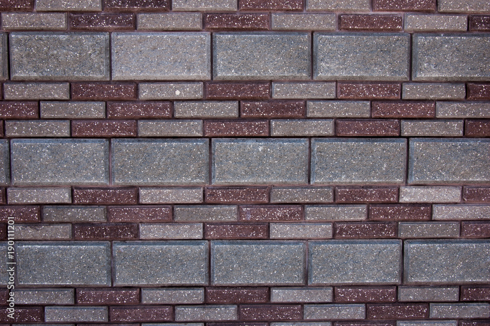 Abstract artistic background: wall of multicolored pavers.