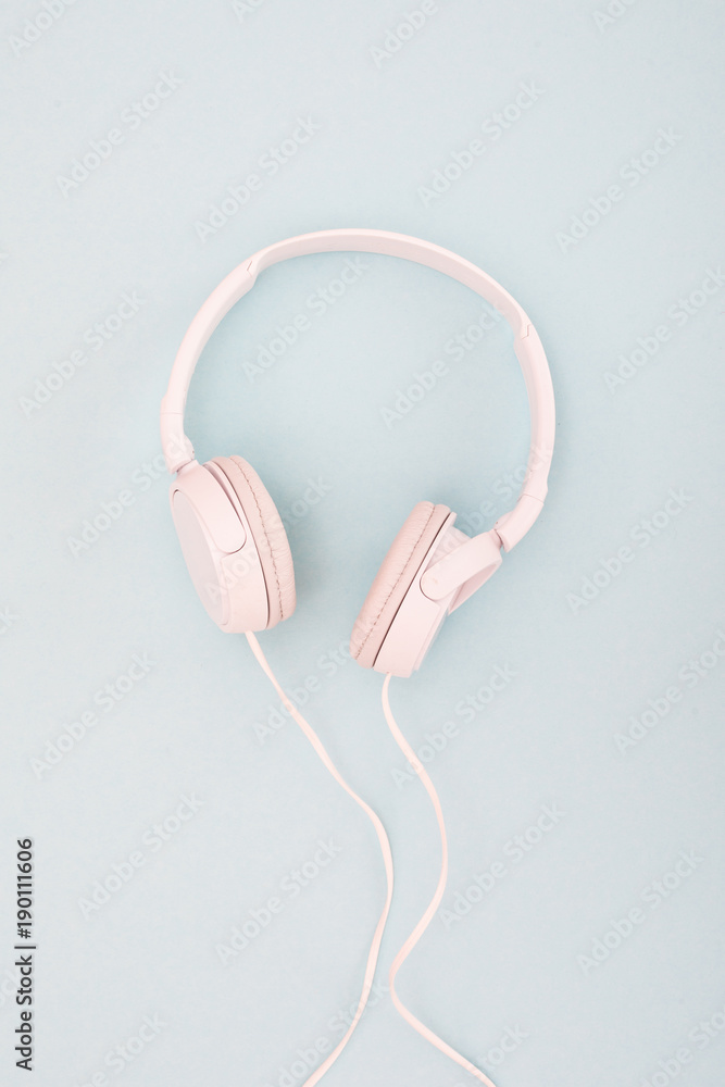 Wireless headphones isolated on a blue background. bluetooth Wireless headphones isolated on a blue background. bluetooth