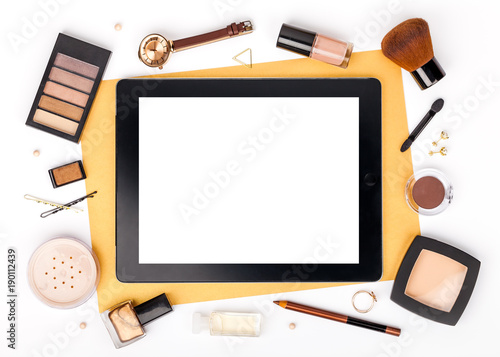 set of decorative cosmetics, makeup tools and accessory with tablet on white background with copy space for text. beauty, fashion, party and shopping concept. flat lay frame composition, top view