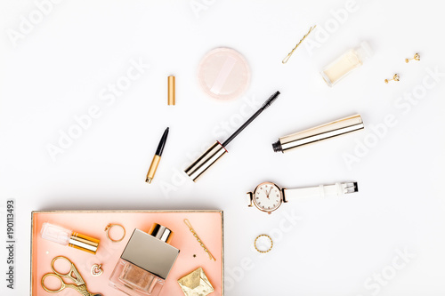 woman make up tools and stylish fashion accessories flying from gift box on white background. celebration, beauty, jewelry and shopping concept. trendy flat lay composition, top view