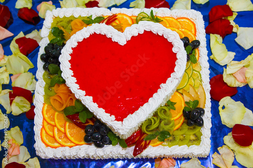 Tasty Cake - Jelly heart with fresh fruits, mint and berries colorful, close up with copy space