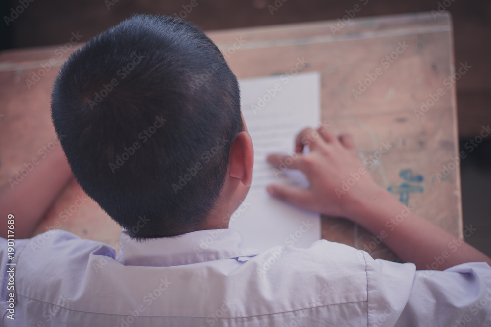 Thai Reading Examination between teacher and student grade 4 .Outside the classroom in primary school. Thai Reading Examination between teacher and student grade 4 .Outside the classroom in primary school.
