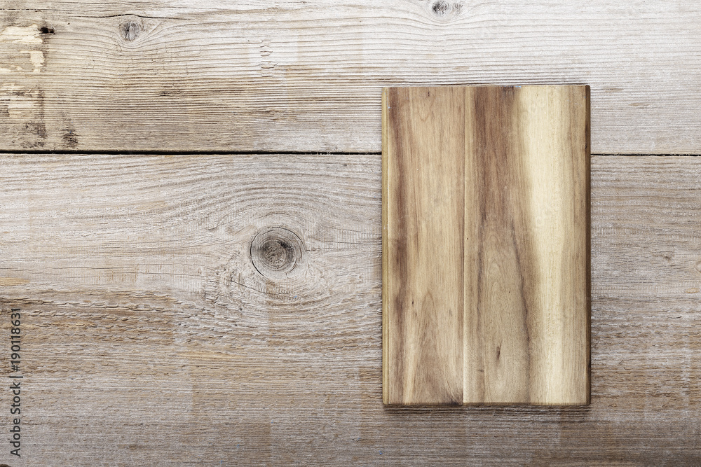 cutting board on a wooden background cutting board on a wooden background