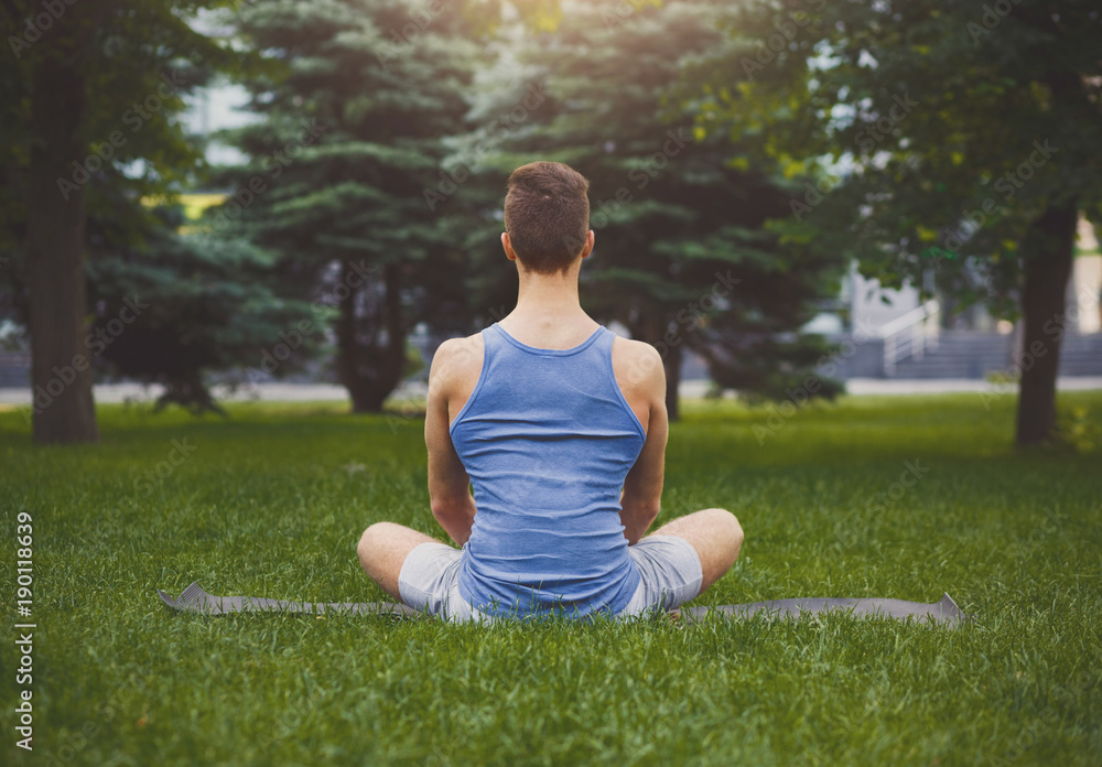 Young man practicing yoga, relax meditation pose Young man practicing yoga, relax meditation pose
