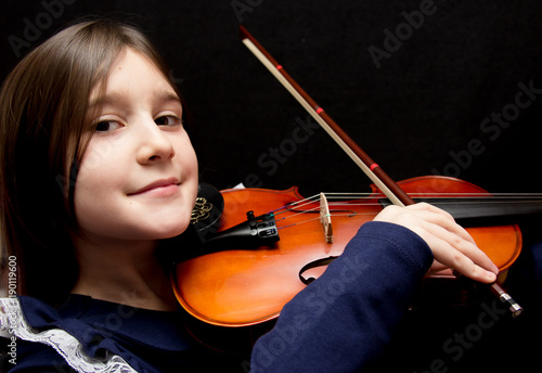Little pretty girl playing violin