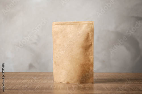 Paper bag on table. Mockup for design © Africa Studio