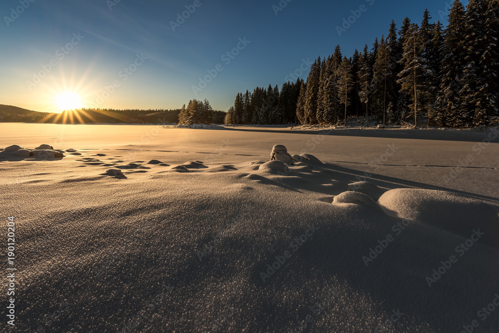 Fototapeta premium Sunset over the frozen lake