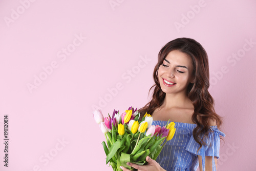 Beautiful woman holding bou...